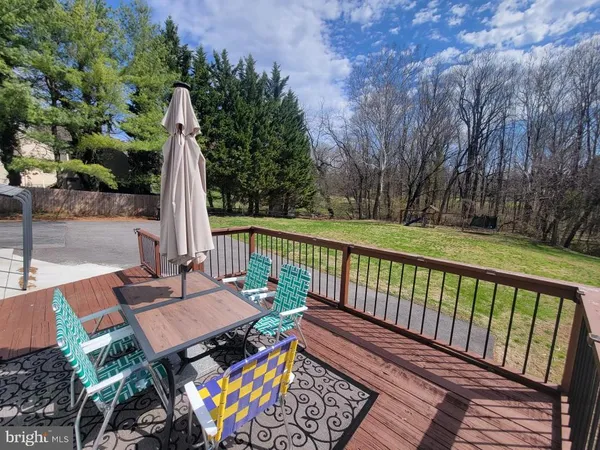 a view of a patio with a table chairs and a table
