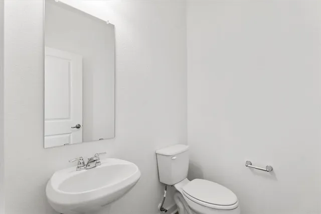 a kitchen with stainless steel appliances granite countertop a sink a stove and a microwave