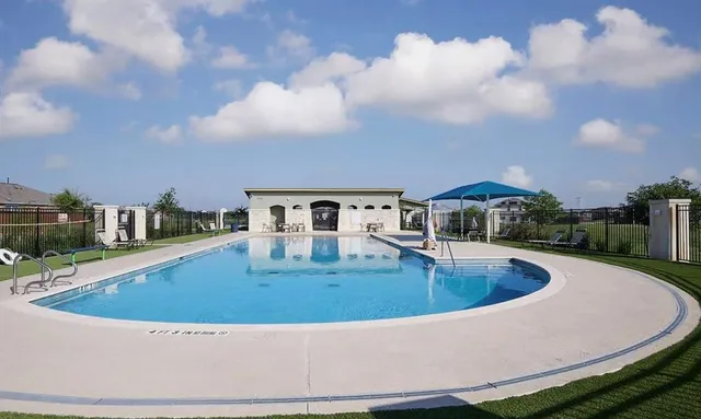 a view of a big yard next to a house