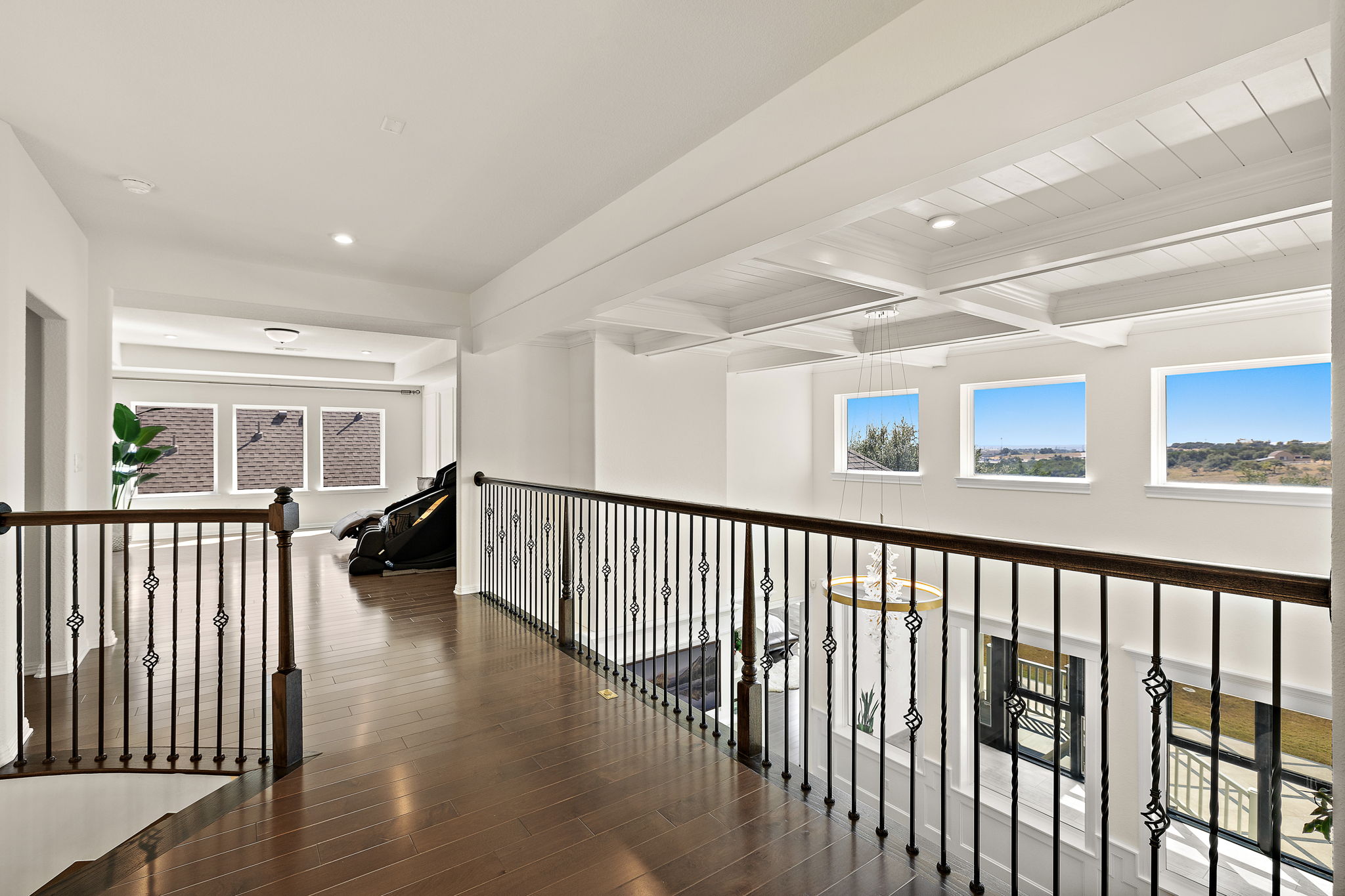 218 Encanto Place Austin, TX 78737 - Photo 27 of 40 a view of hallway with wooden floor and windows