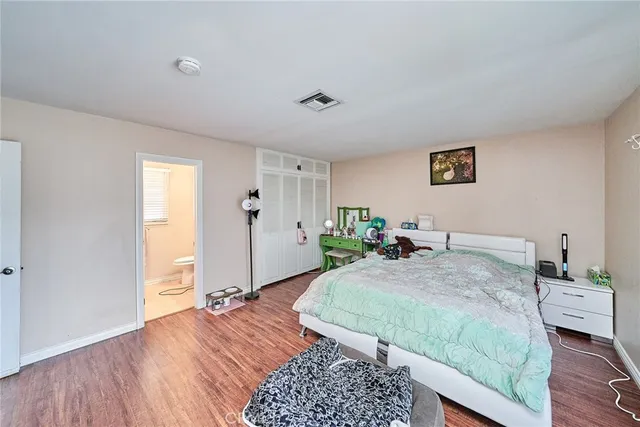 a bed room with a bed and a window