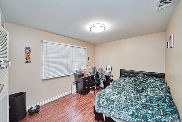 a bedroom with furniture and a window