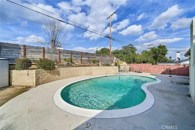 a view of a swimming pool with a patio