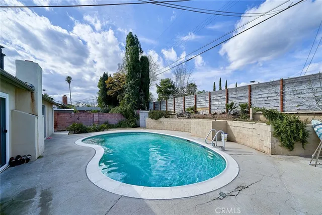 a view of a swimming pool with a patio