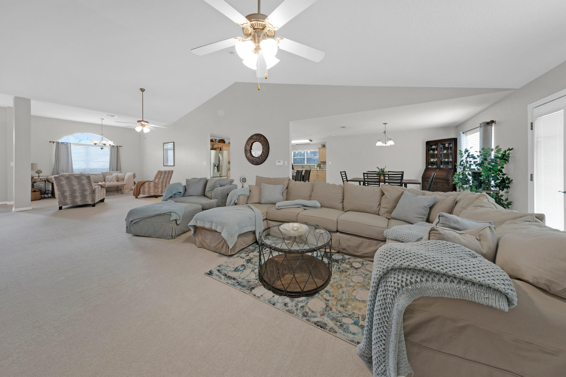 20 East Shipwreck Road Santa Rosa Beach, FL 32459 - Photo 11 of 37 a living room with furniture a clock and a ceiling fan