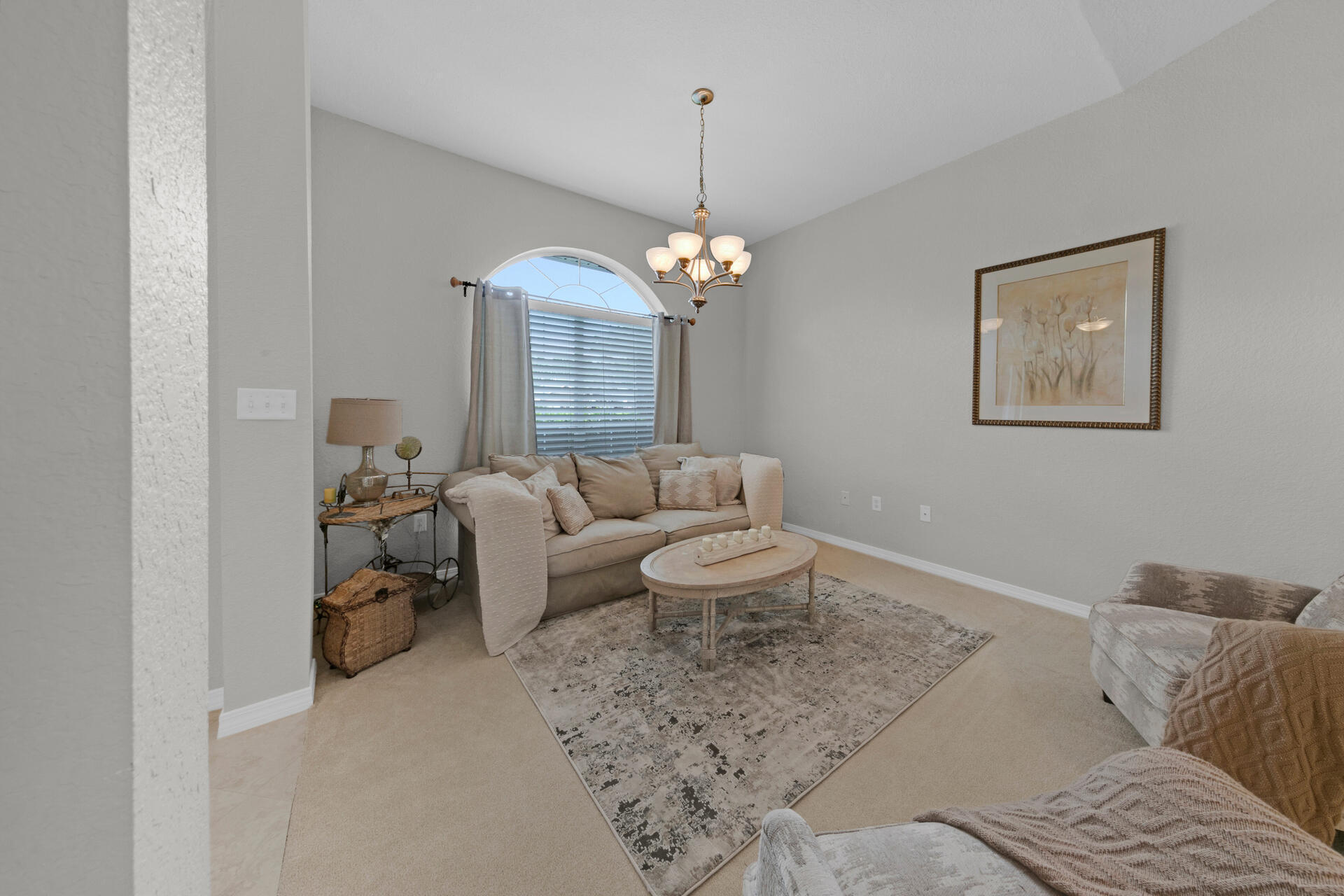 20 East Shipwreck Road Santa Rosa Beach, FL 32459 - Photo 14 of 37 a living room with furniture and a chandelier