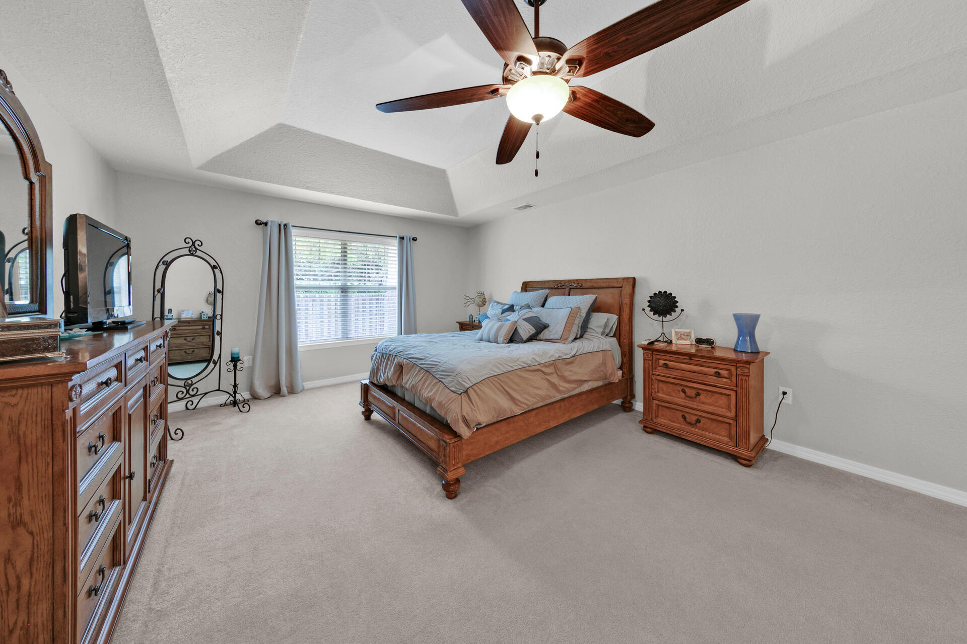 20 East Shipwreck Road Santa Rosa Beach, FL 32459 - Photo 15 of 37 a bedroom with furniture and a flat screen tv