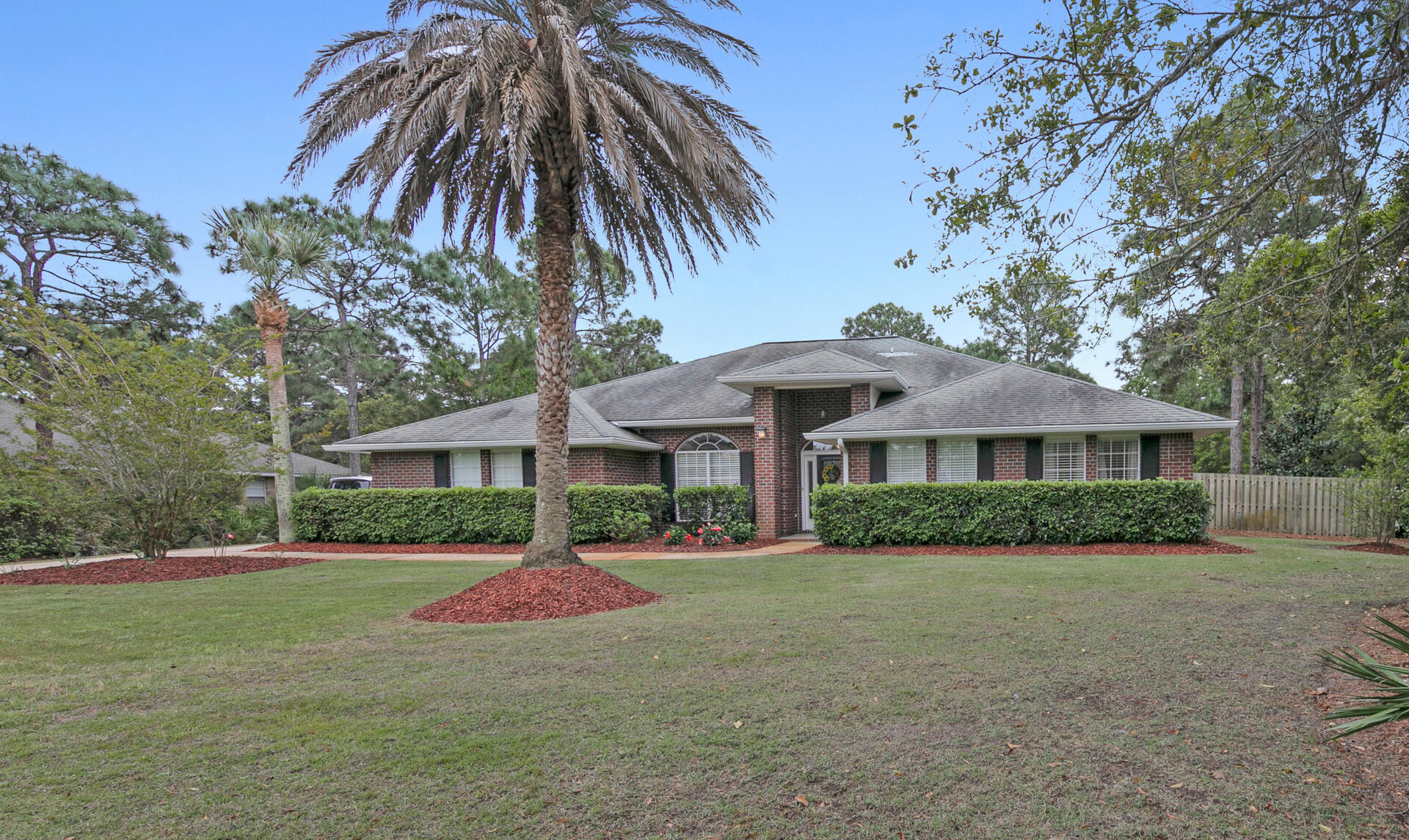20 East Shipwreck Road Santa Rosa Beach, FL 32459 - Photo 2 of 37 a front view of a house with yard and green space