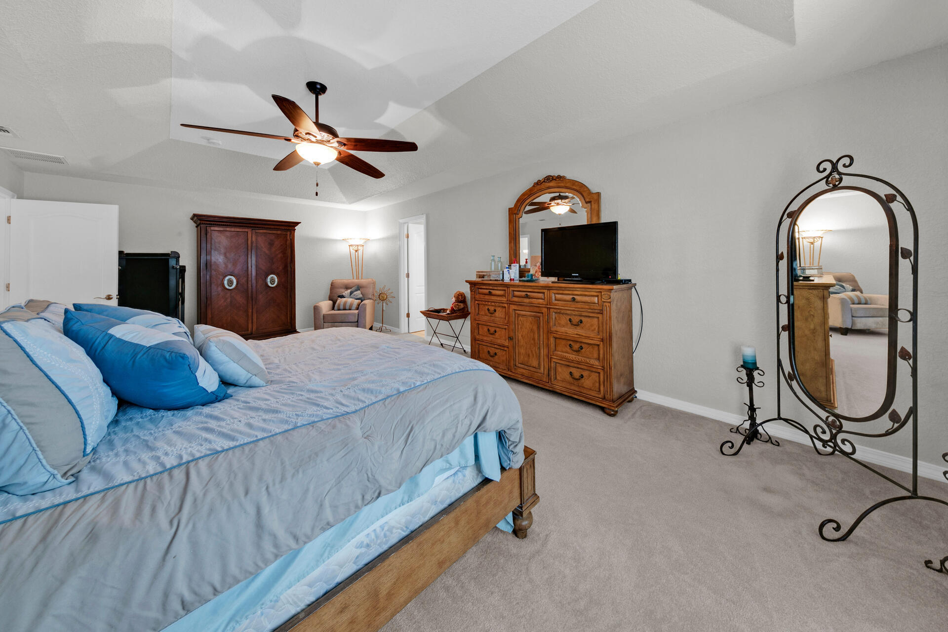 20 East Shipwreck Road Santa Rosa Beach, FL 32459 - Photo 22 of 37 a bedroom with a bed a ceiling fan and a dresser