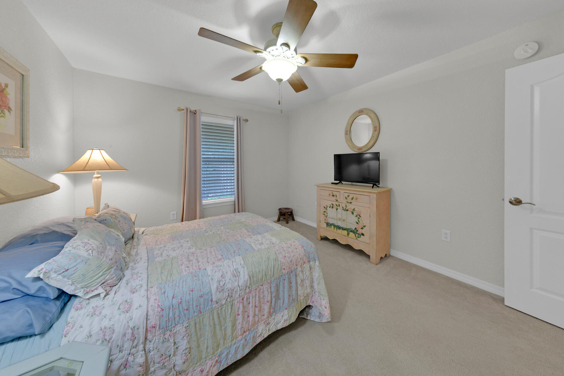 20 East Shipwreck Road Santa Rosa Beach, FL 32459 - Photo 23 of 37 a bedroom with a bed a chandelier and dresser