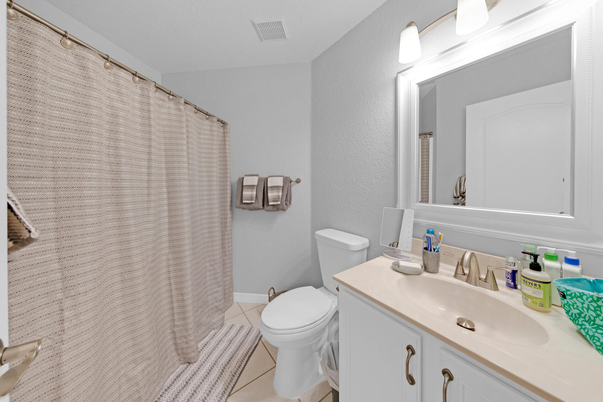 20 East Shipwreck Road Santa Rosa Beach, FL 32459 - Photo 25 of 37 a bathroom with a sink a toilet and mirror