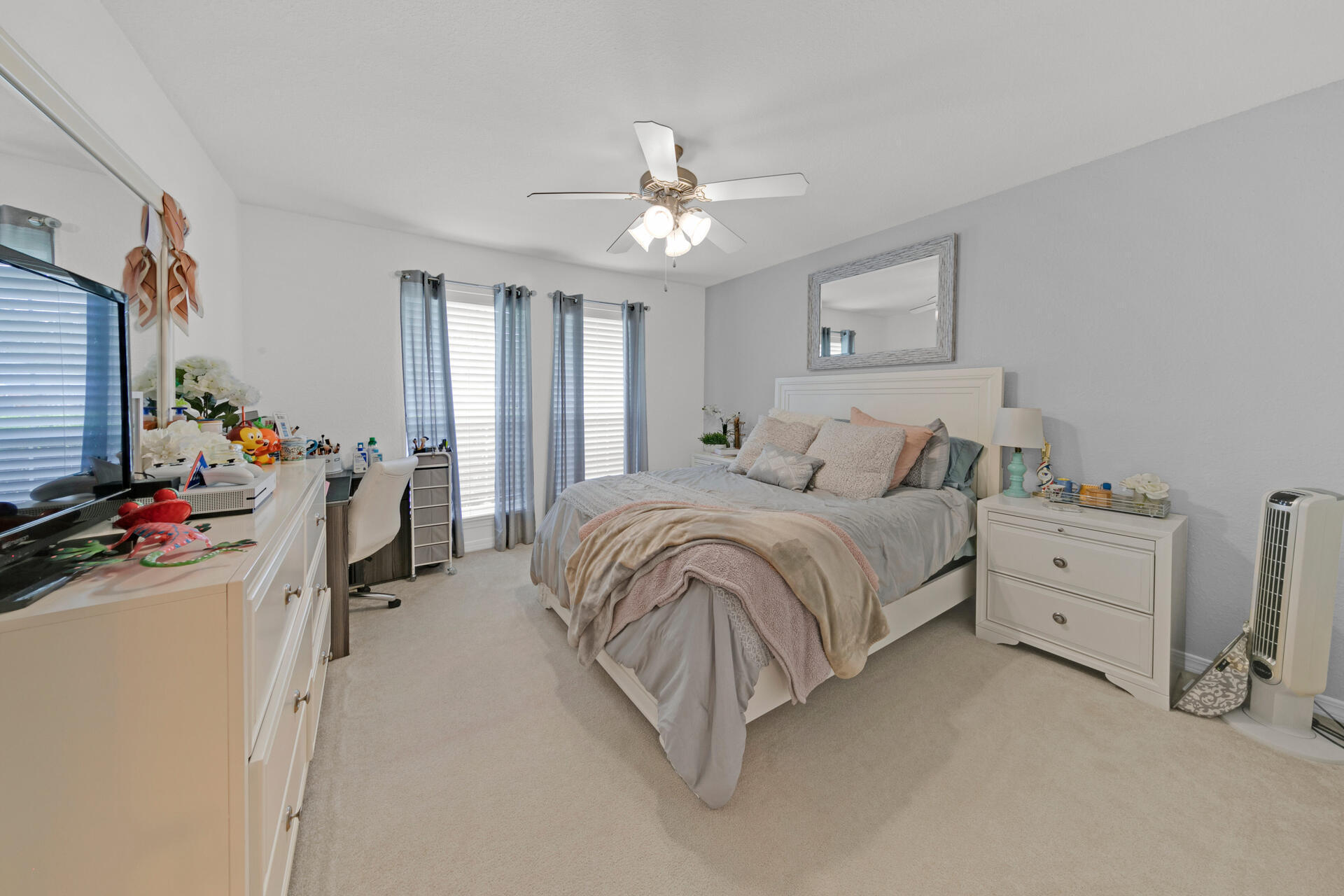 20 East Shipwreck Road Santa Rosa Beach, FL 32459 - Photo 27 of 37 a bedroom with a bed and a chandelier