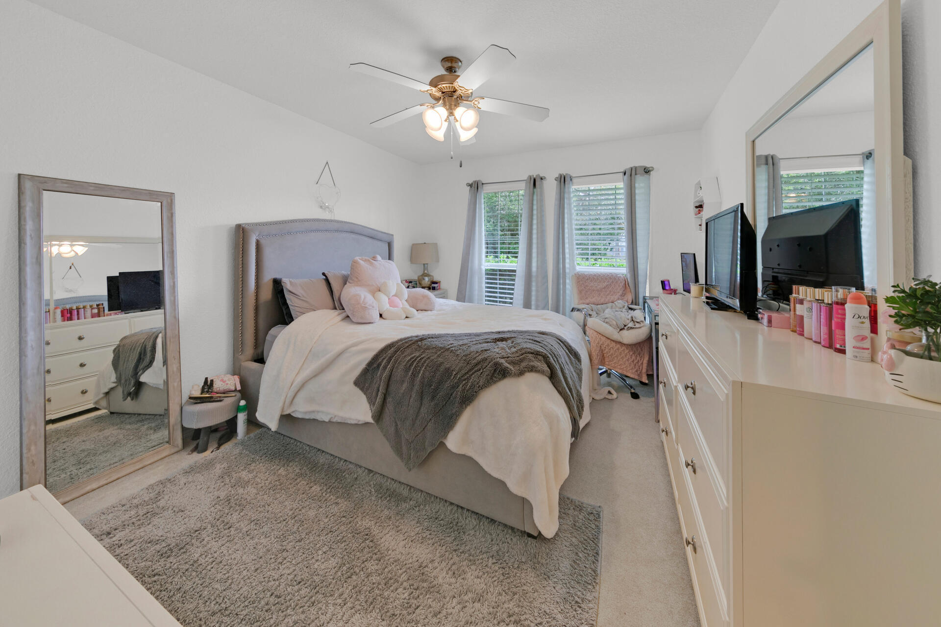 20 East Shipwreck Road Santa Rosa Beach, FL 32459 - Photo 30 of 37 a bedroom with a bed and a large mirror with a flat tv screen