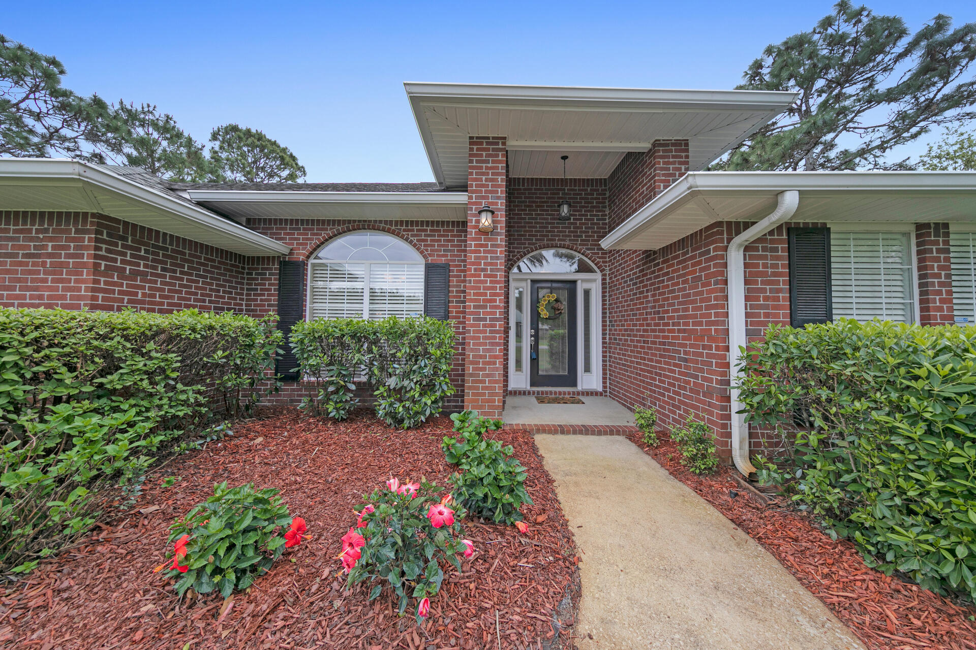 20 East Shipwreck Road Santa Rosa Beach, FL 32459 - Photo 3 of 37 a front view of a house with a garden