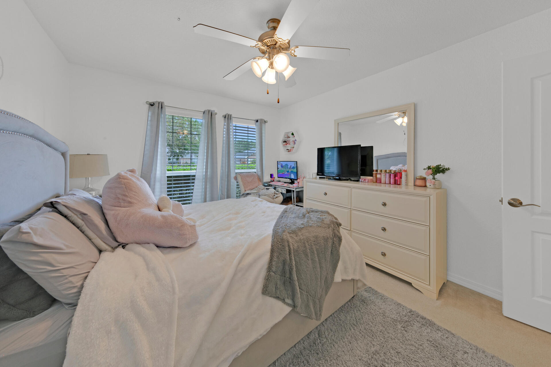 20 East Shipwreck Road Santa Rosa Beach, FL 32459 - Photo 31 of 37 a bedroom with a large bed and a chandelier