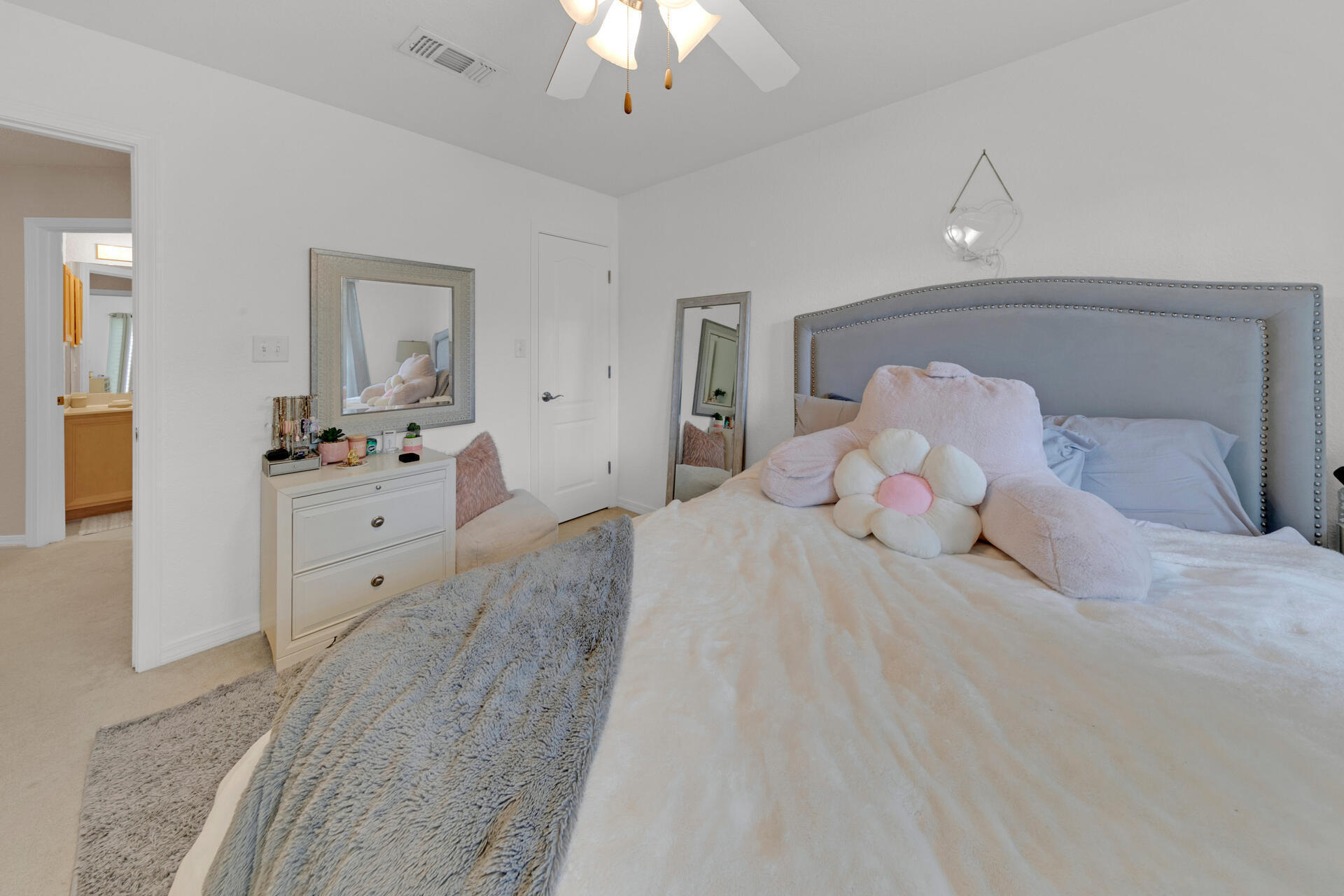 20 East Shipwreck Road Santa Rosa Beach, FL 32459 - Photo 32 of 37 a bedroom with a large bed and a chandelier