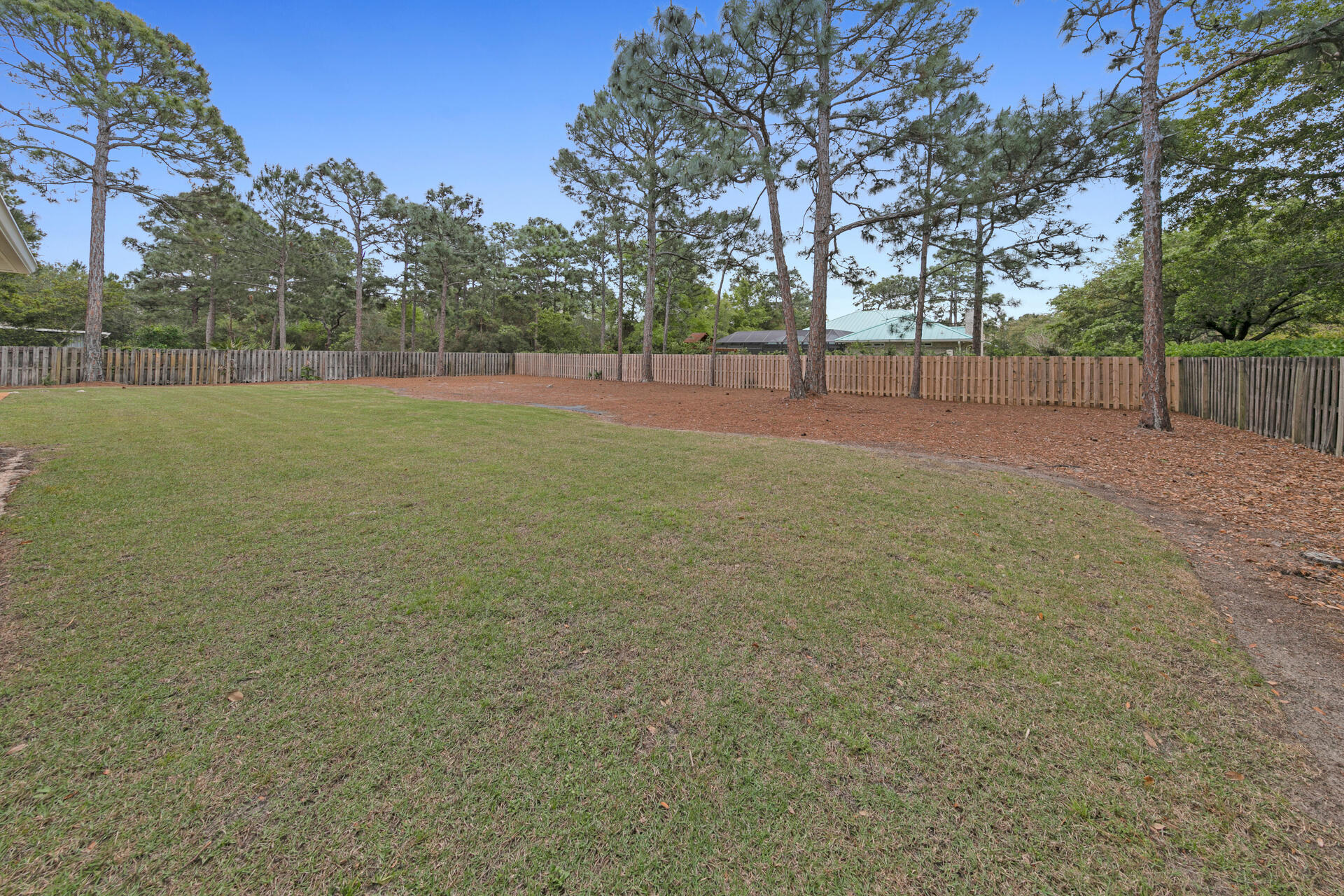 20 East Shipwreck Road Santa Rosa Beach, FL 32459 - Photo 34 of 37 a view of a field with trees in the background