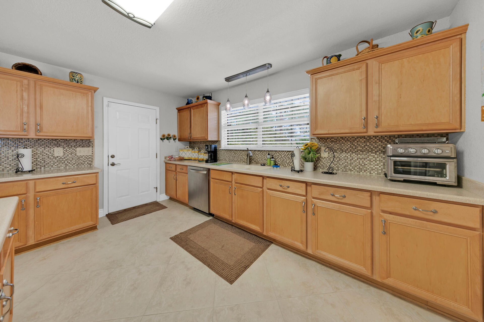 20 East Shipwreck Road Santa Rosa Beach, FL 32459 - Photo 4 of 37 a kitchen with stainless steel appliances granite countertop a sink stove and cabinets