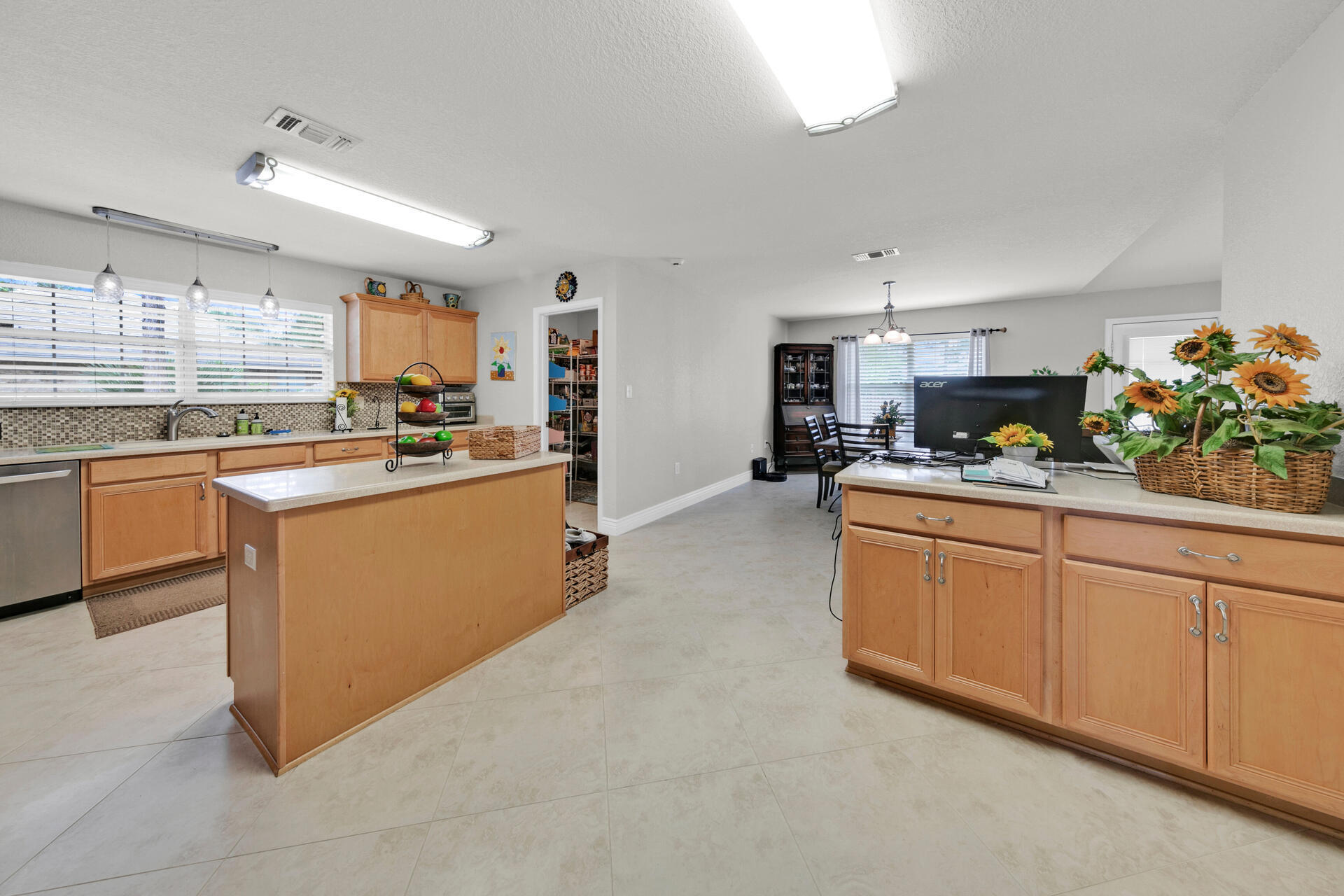 20 East Shipwreck Road Santa Rosa Beach, FL 32459 - Photo 7 of 37 a kitchen with stainless steel appliances granite countertop a sink stove and refrigerator