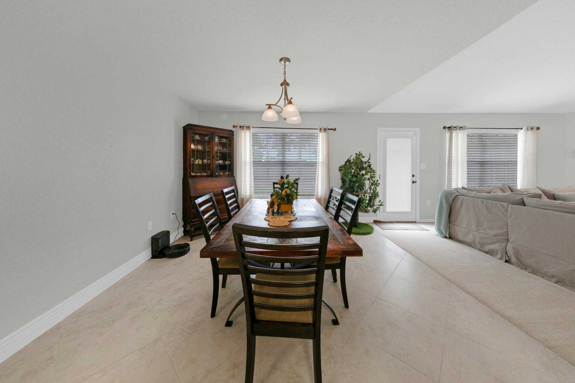 20 East Shipwreck Road Santa Rosa Beach, FL 32459 - Photo 10 of 37 a living room with furniture a window and a chandelier