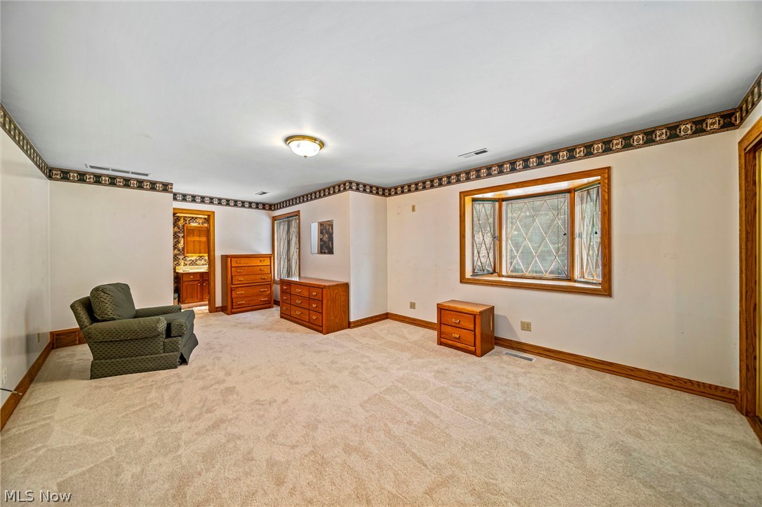 8801 Bunker Road Orwell, OH 44076 - Photo 34 of 50 Unfurnished room featuring baseboards and light carpet