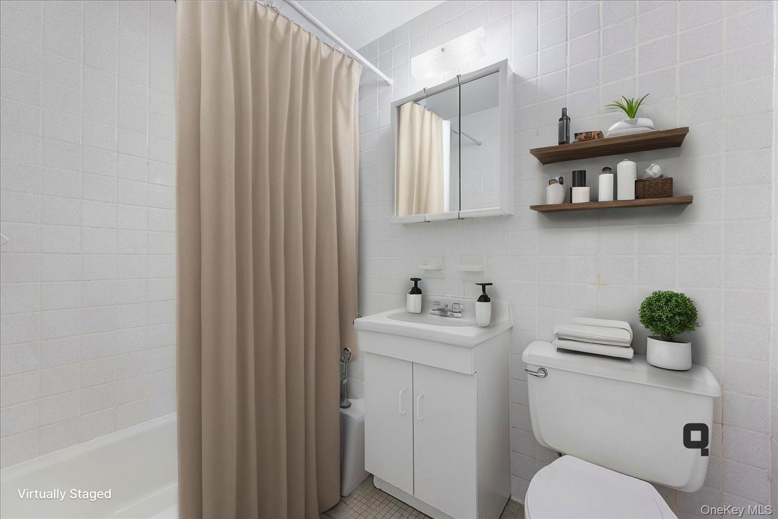 2550 Olinville Avenue, Unit 8H Bronx, NY 10467 - Photo 4 of 24 Staged Virtually Full bathroom with vanity, shower / bath combo with shower curtain, and tile walls