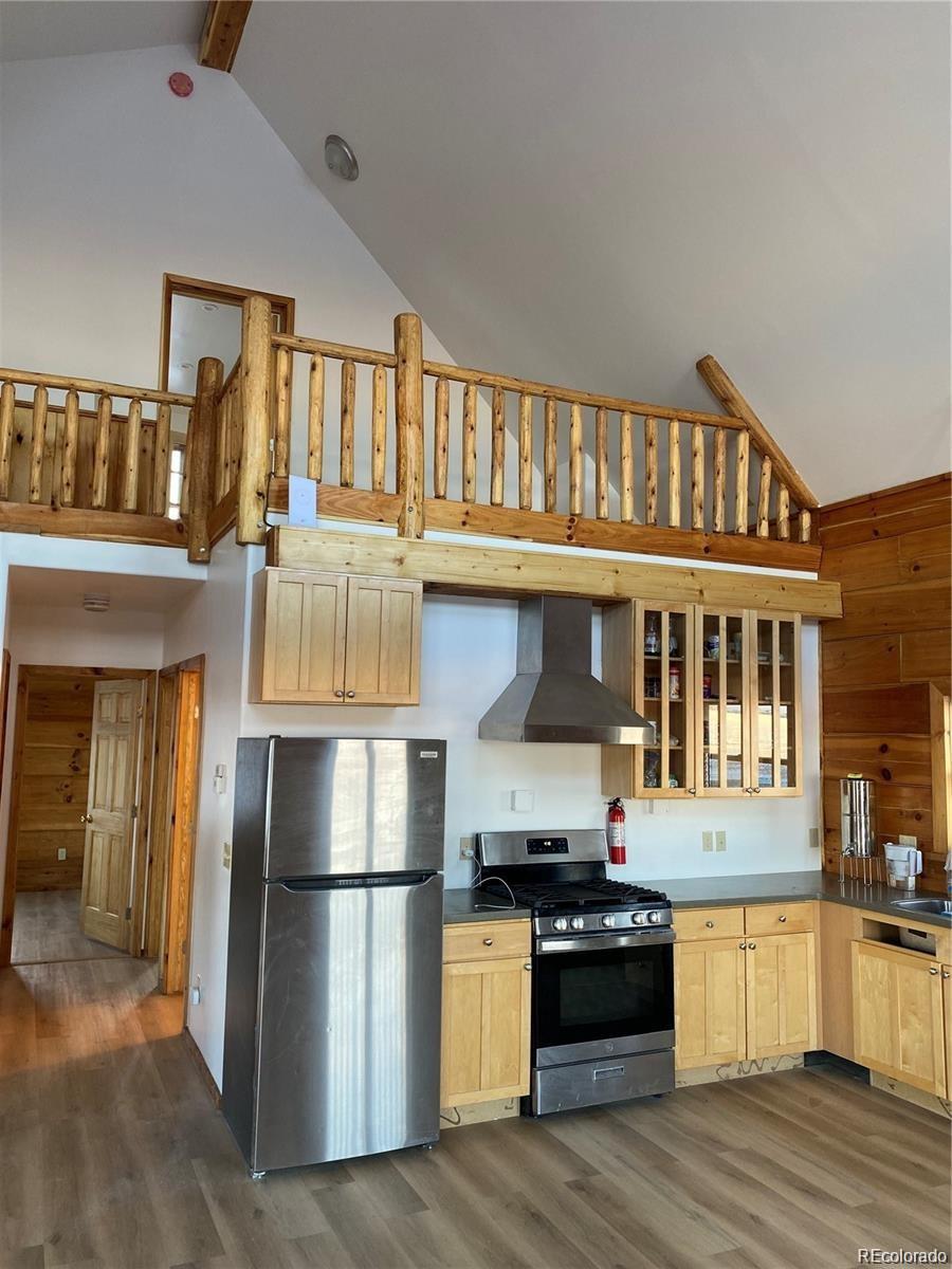 113 Nana Road Hartsel, CO 80449 - Photo 4 of 9 a kitchen with stainless steel appliances granite countertop a refrigerator stove and oven