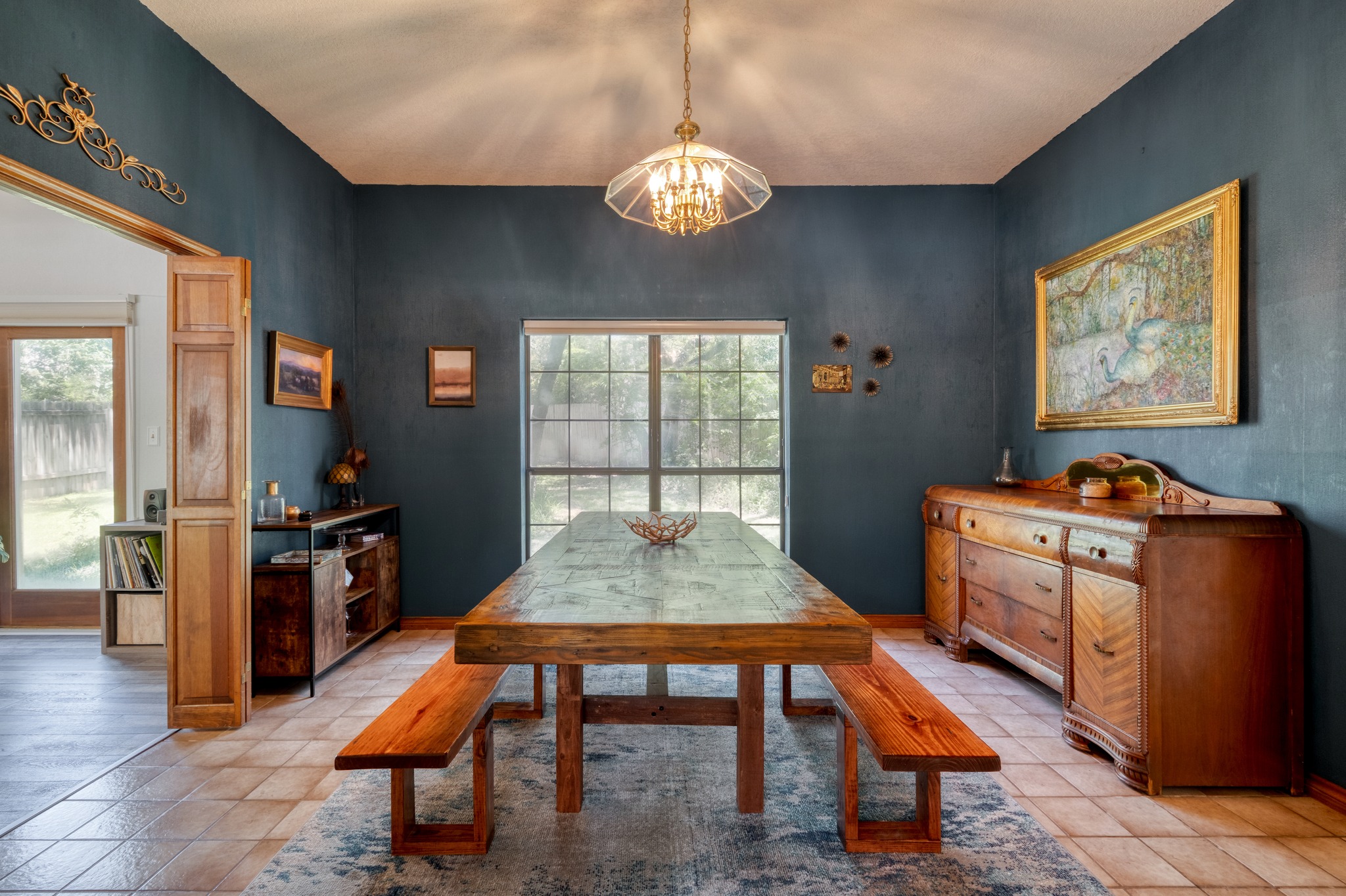 202 Ridgewood Drive Georgetown, TX 78628 - Photo 10 of 40 a dining room with a table chairs and a kitchen view