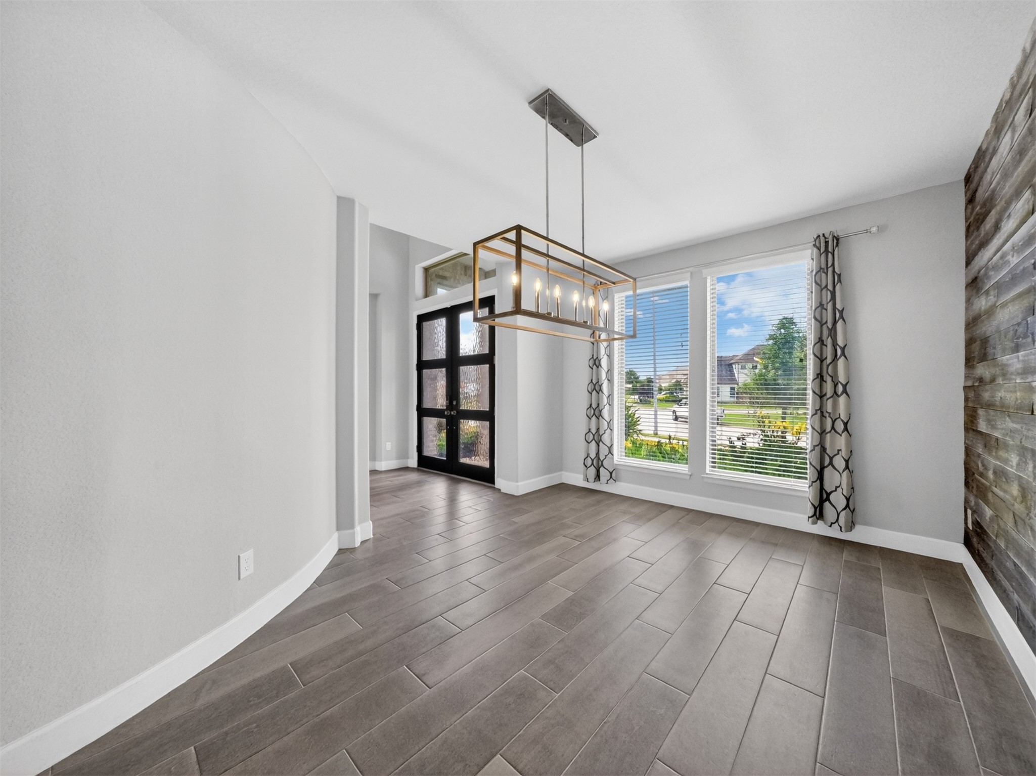 4343 Martin Ridge Drive Manvel, TX 77578 - Photo 10 of 50 a view of a big room with windows and hardwood floor