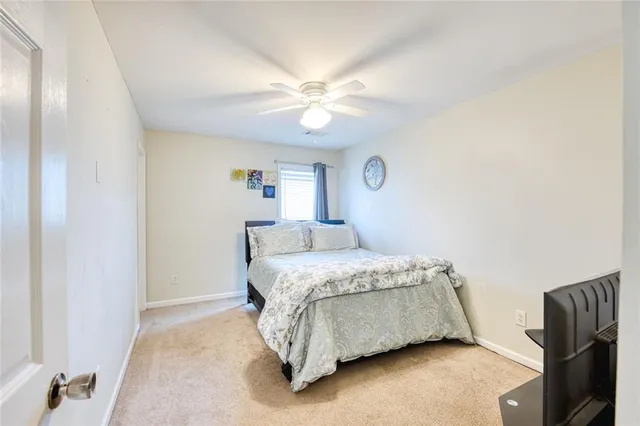 a bathroom with a double vanity sink toilet and shower
