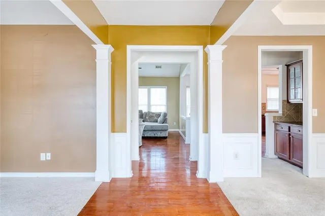 a view of a living room with a bed and a view of bedroom