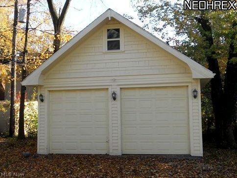 3642 Bainbridge Road Cleveland Heights, OH 44118 - Photo 5 of 25 Newly built garage, full wired with two automatic openers! (stick built w gable!!)with walkable attic (pull-down ladder) & power circulation fan, mandoor, (4) outside lights, keyless entry. Vynal sided with real wook shake on gable!! Up to $20,000.00 to have a similar structure built from ground up!!