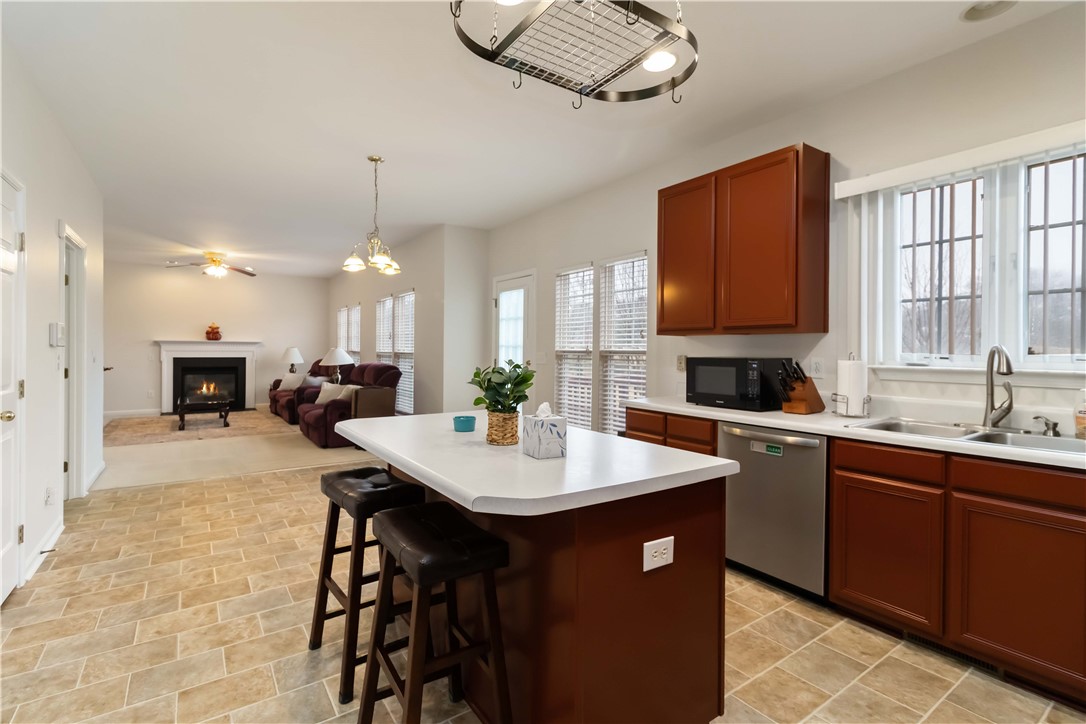 215 Ridge Bay Court Greenville, SC 29611 - Photo 11 of 34 This open concept kitchen and living space provides seamless flow for daily living.