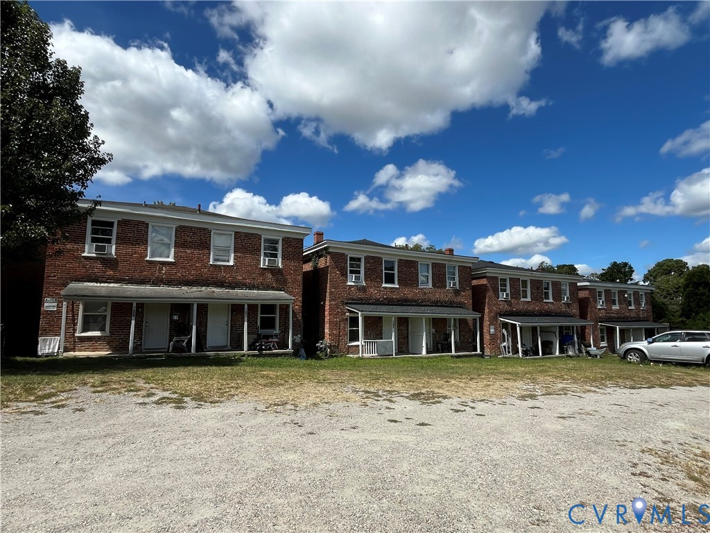 635-701 Harding Street Petersburg, VA 23803 - Photo 3 of 14 a view of a house with a backyard