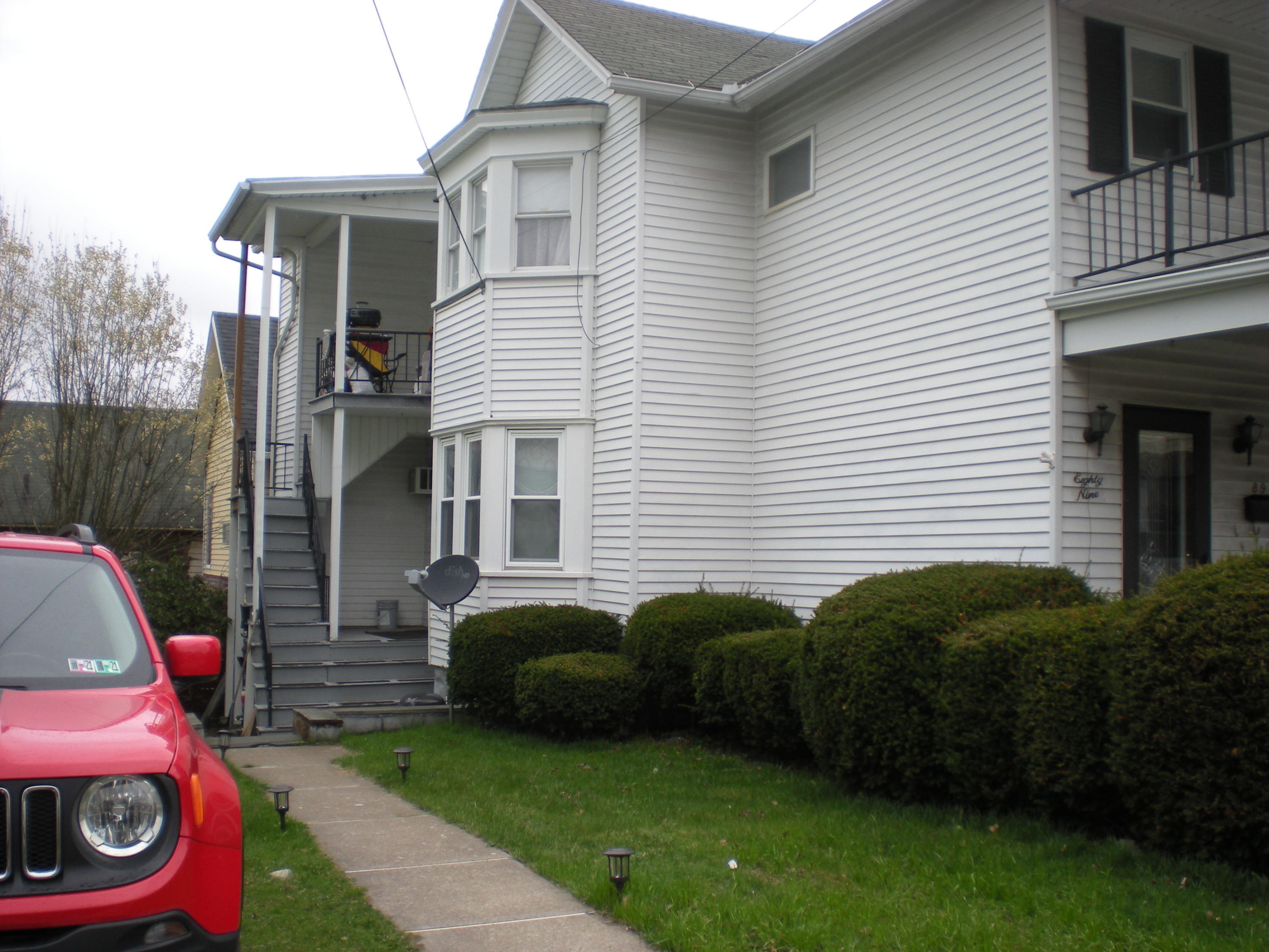 89 Belmont Street Carbondale, PA 18407 - Photo 2 of 26 a view of a house with a back yard