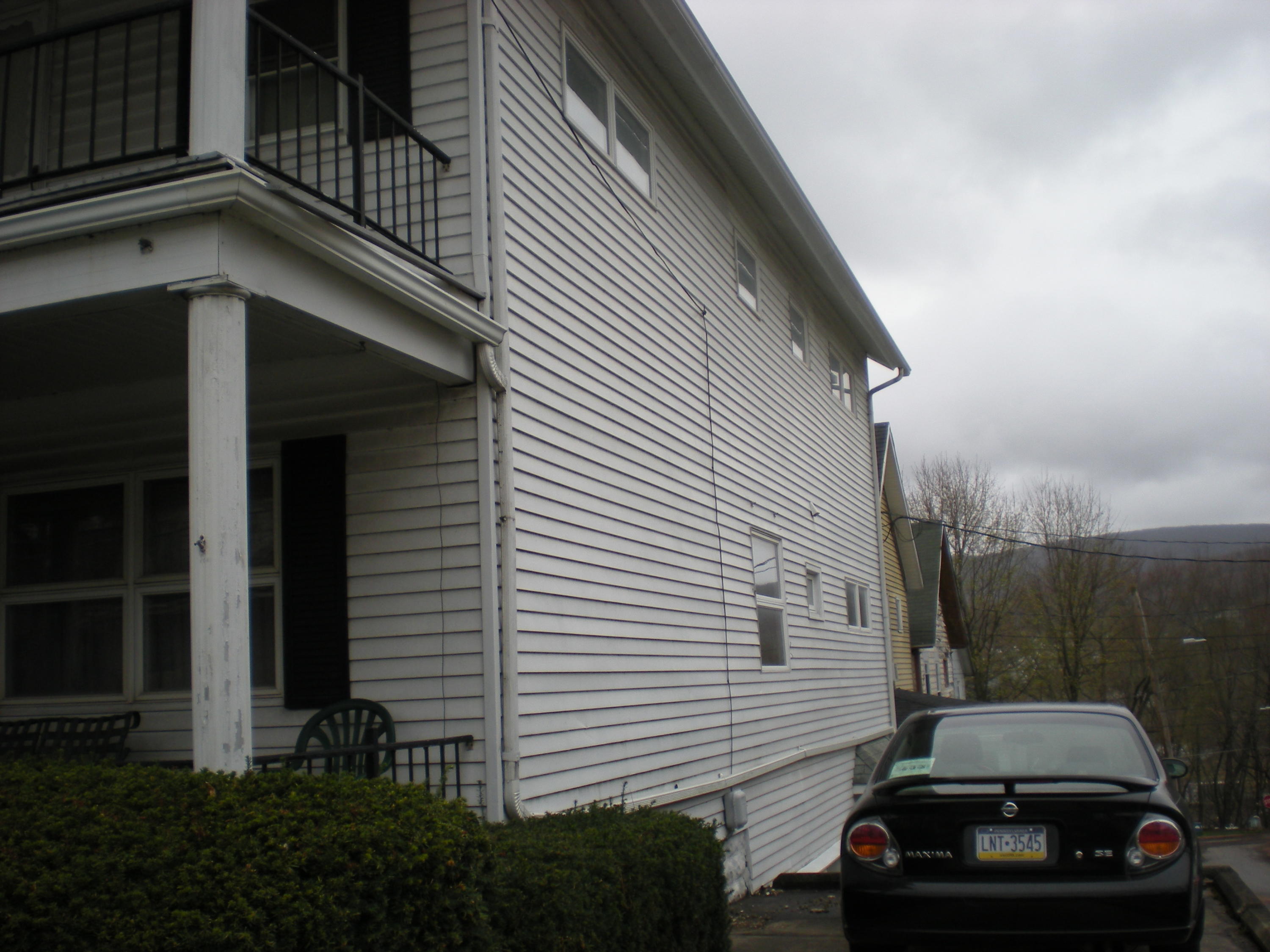 89 Belmont Street Carbondale, PA 18407 - Photo 5 of 26 a view of a house with a car parked on road
