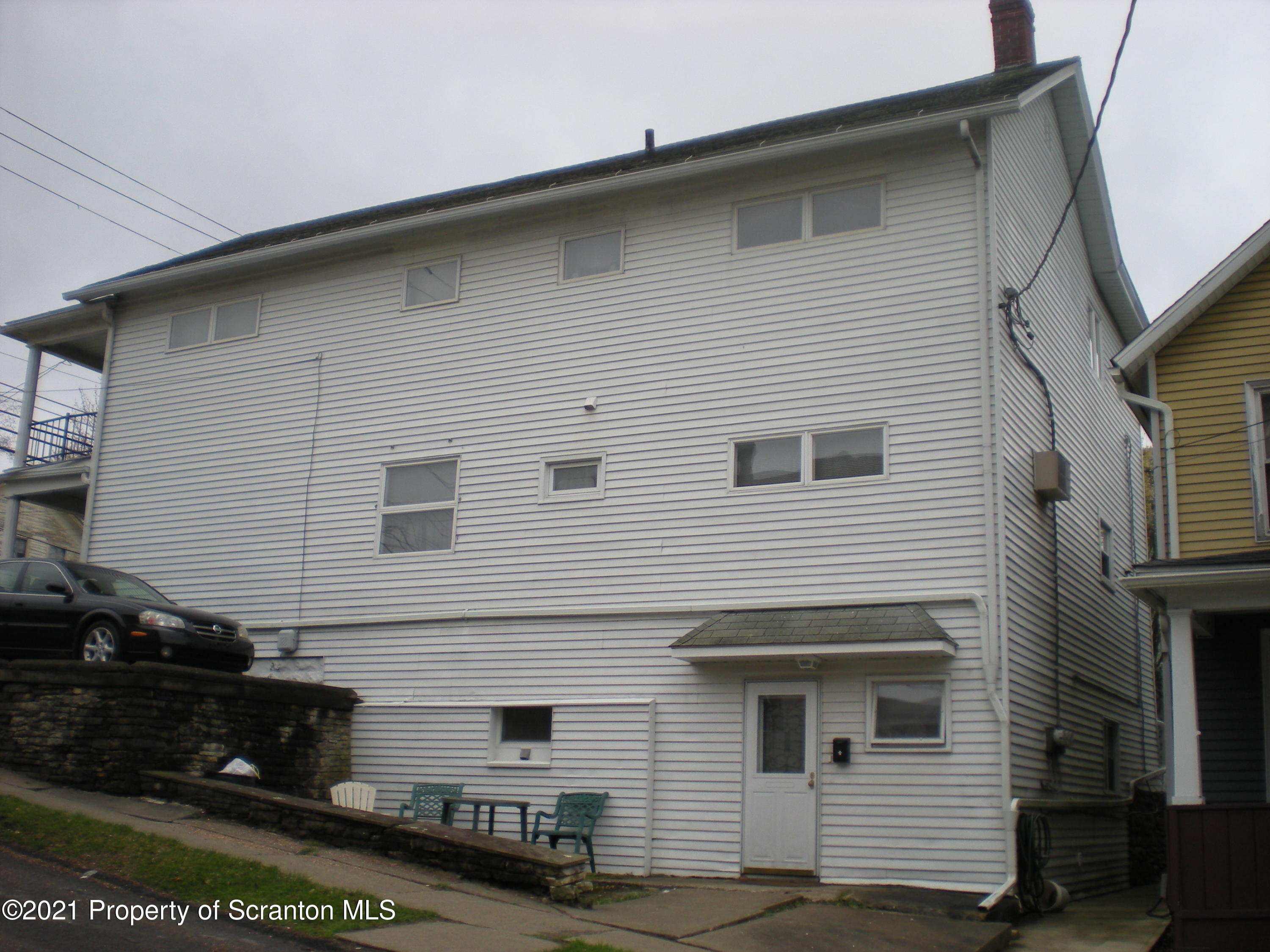 89 Belmont Street Carbondale, PA 18407 - Photo 6 of 26 a front view of a house with a garage