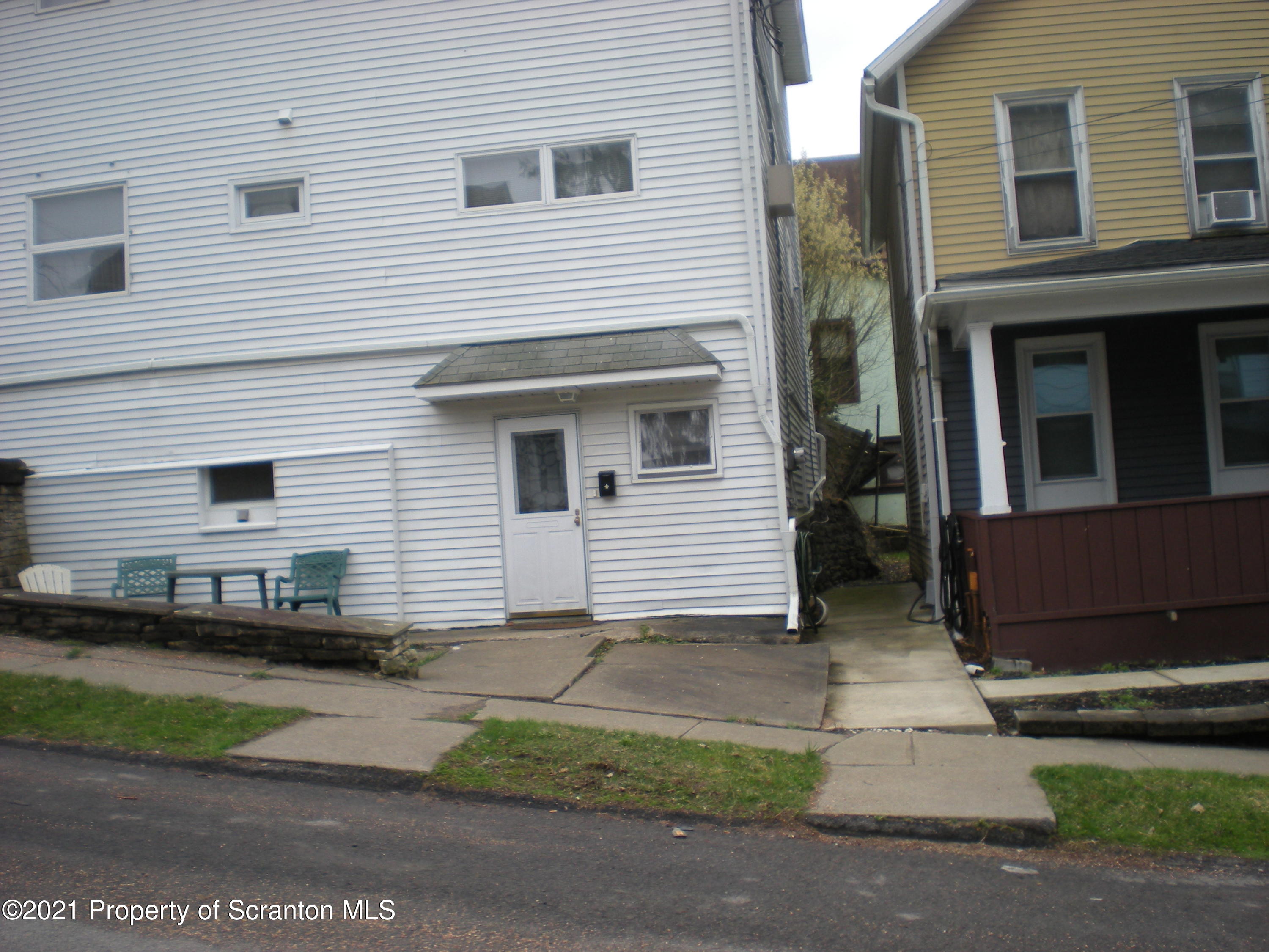 89 Belmont Street Carbondale, PA 18407 - Photo 7 of 26 a view of a house with a yard