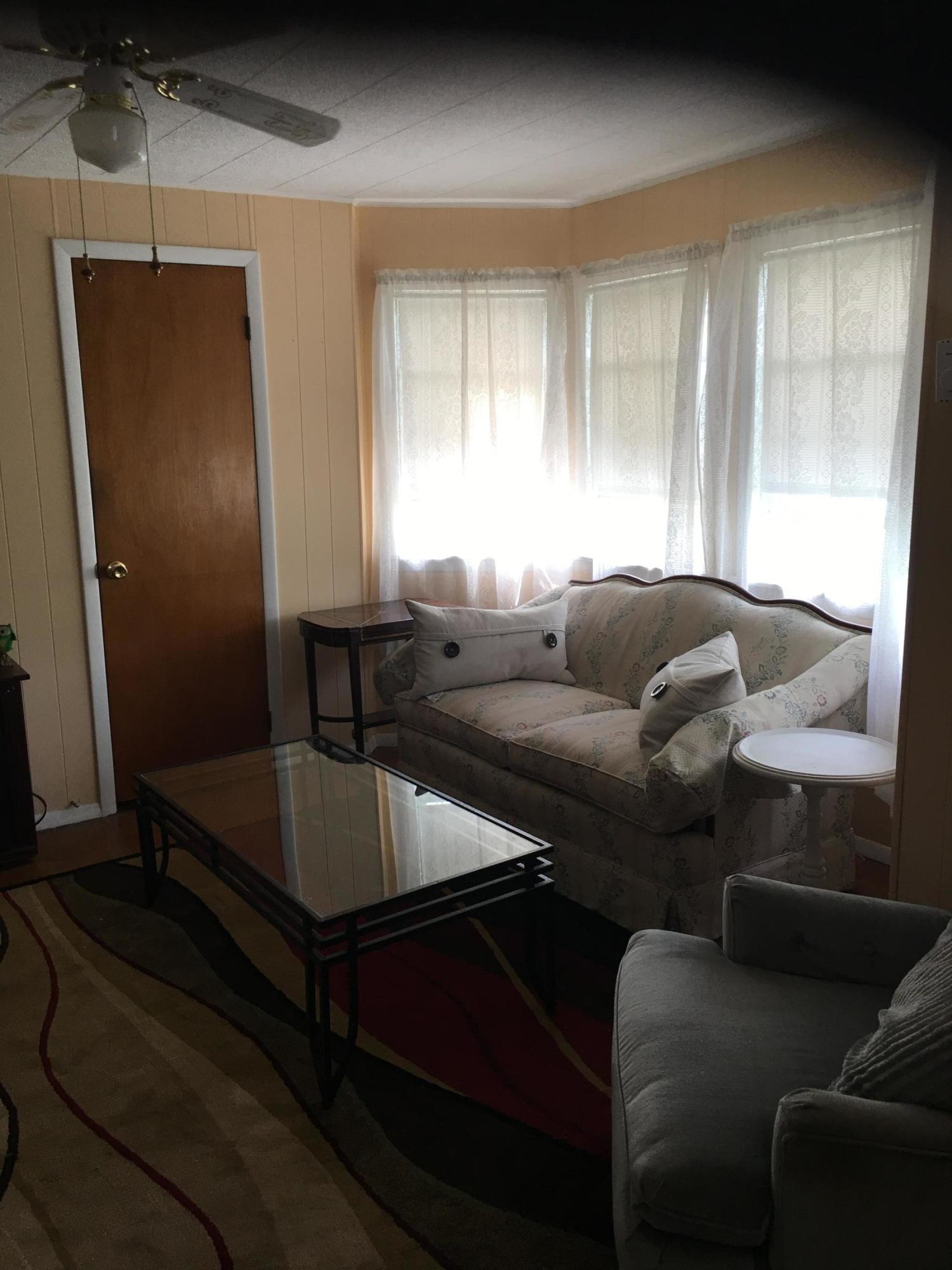 89 Belmont Street Carbondale, PA 18407 - Photo 10 of 26 a living room with furniture and a window