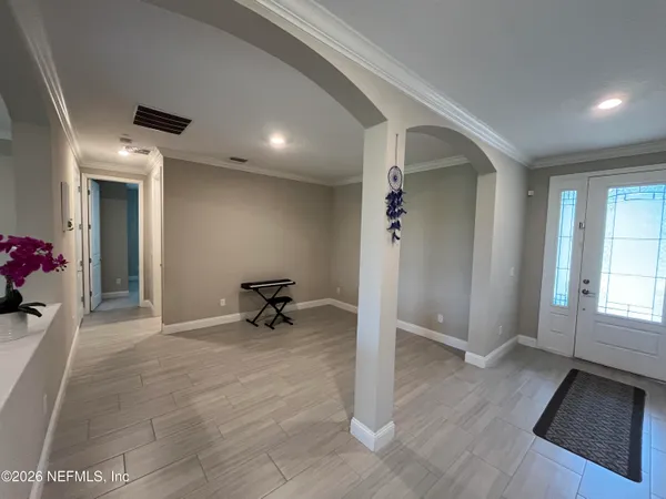 a view of an empty room with a window