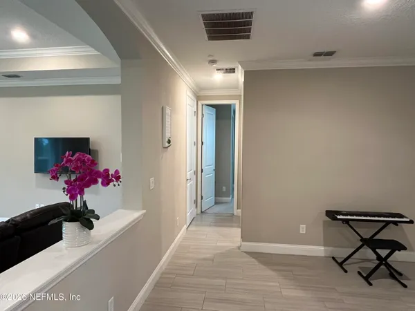 a bathroom with a glass shower door