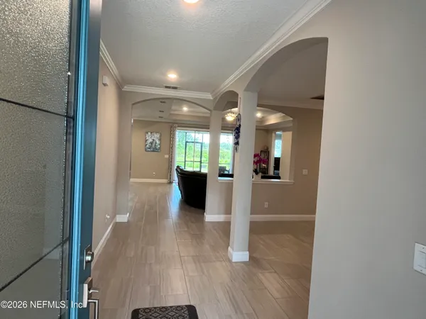 a bathroom with a glass shower door