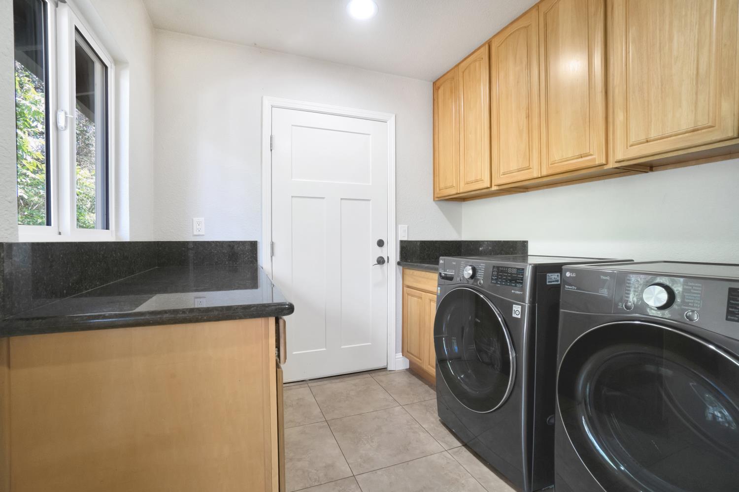 6299 Horseshoe Bar Road Loomis, CA 95650 - Photo 24 of 43 a utility room with dryer and washer