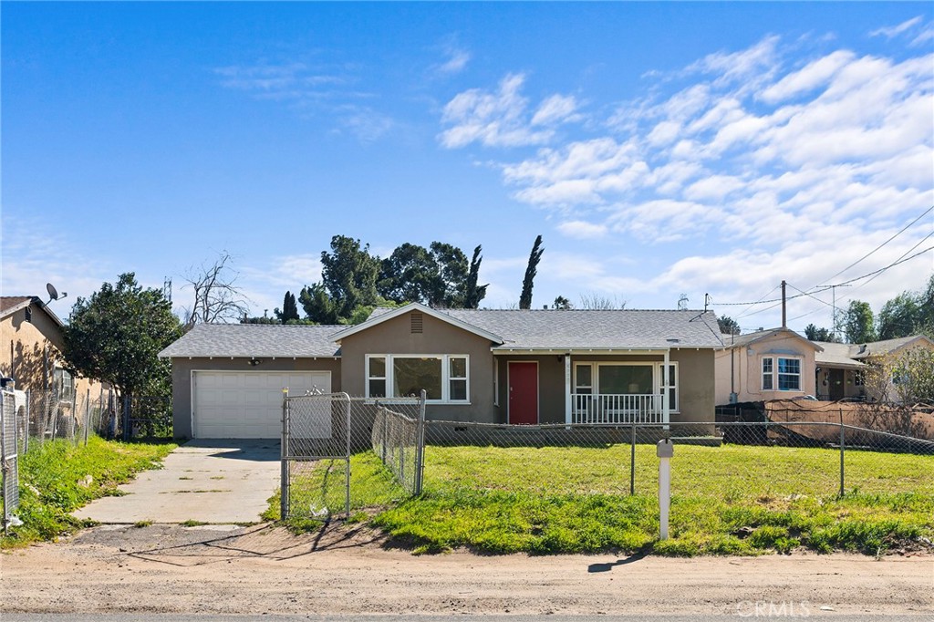 6900 Jurupa Road Riverside, CA 92509 - Photo 1 of 1 a front view of a house with a garden