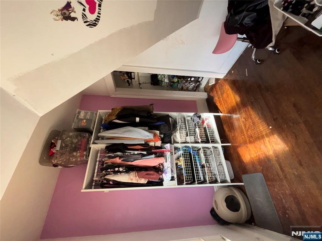 879 Madison Avenue Paterson, NJ 07501 - Photo 14 of 18 a room with furniture and gym equipment