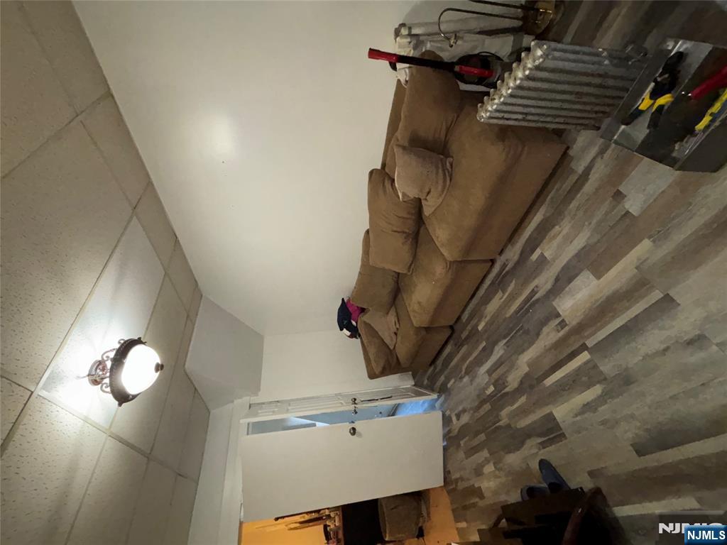 879 Madison Avenue Paterson, NJ 07501 - Photo 3 of 18 a living room with furniture