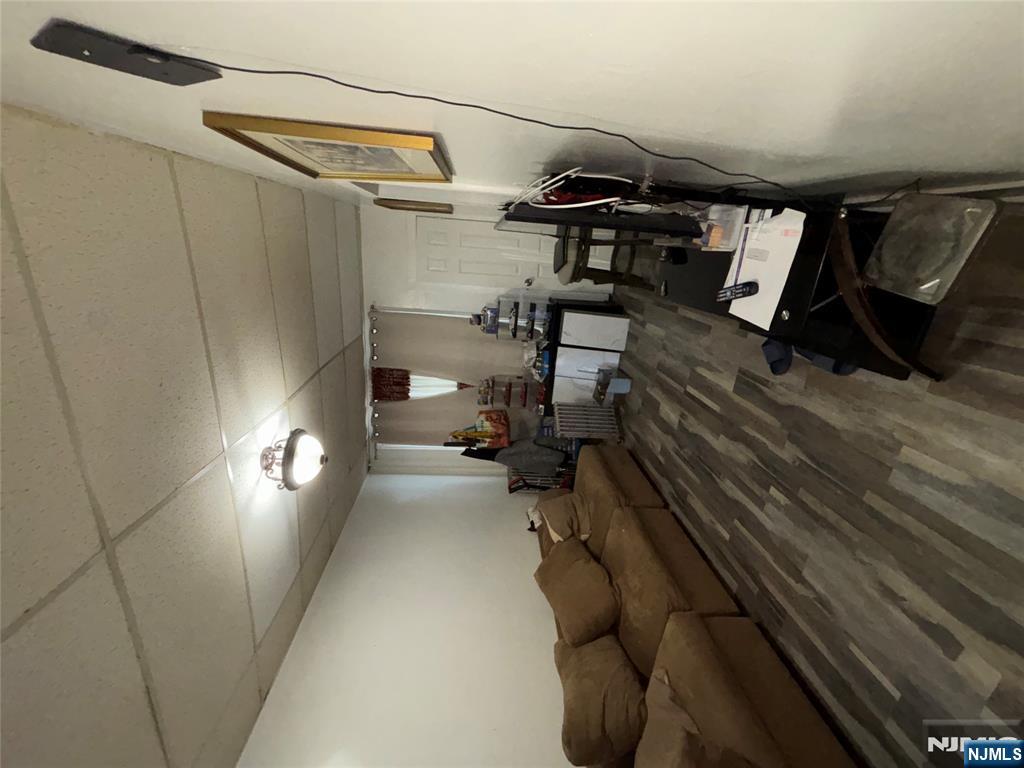 879 Madison Avenue Paterson, NJ 07501 - Photo 4 of 18 a living room with furniture