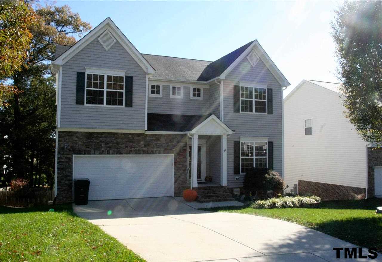 197 Mickleson Ridge Drive Raleigh, NC 27603 - Photo 1 of 25 a front view of a house with a yard and garage