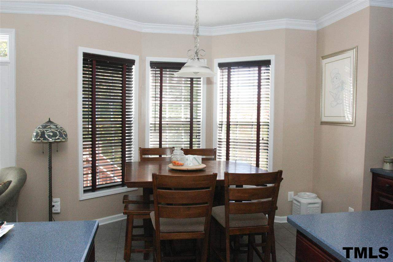 197 Mickleson Ridge Drive Raleigh, NC 27603 - Photo 12 of 25 a dining room with furniture and windows