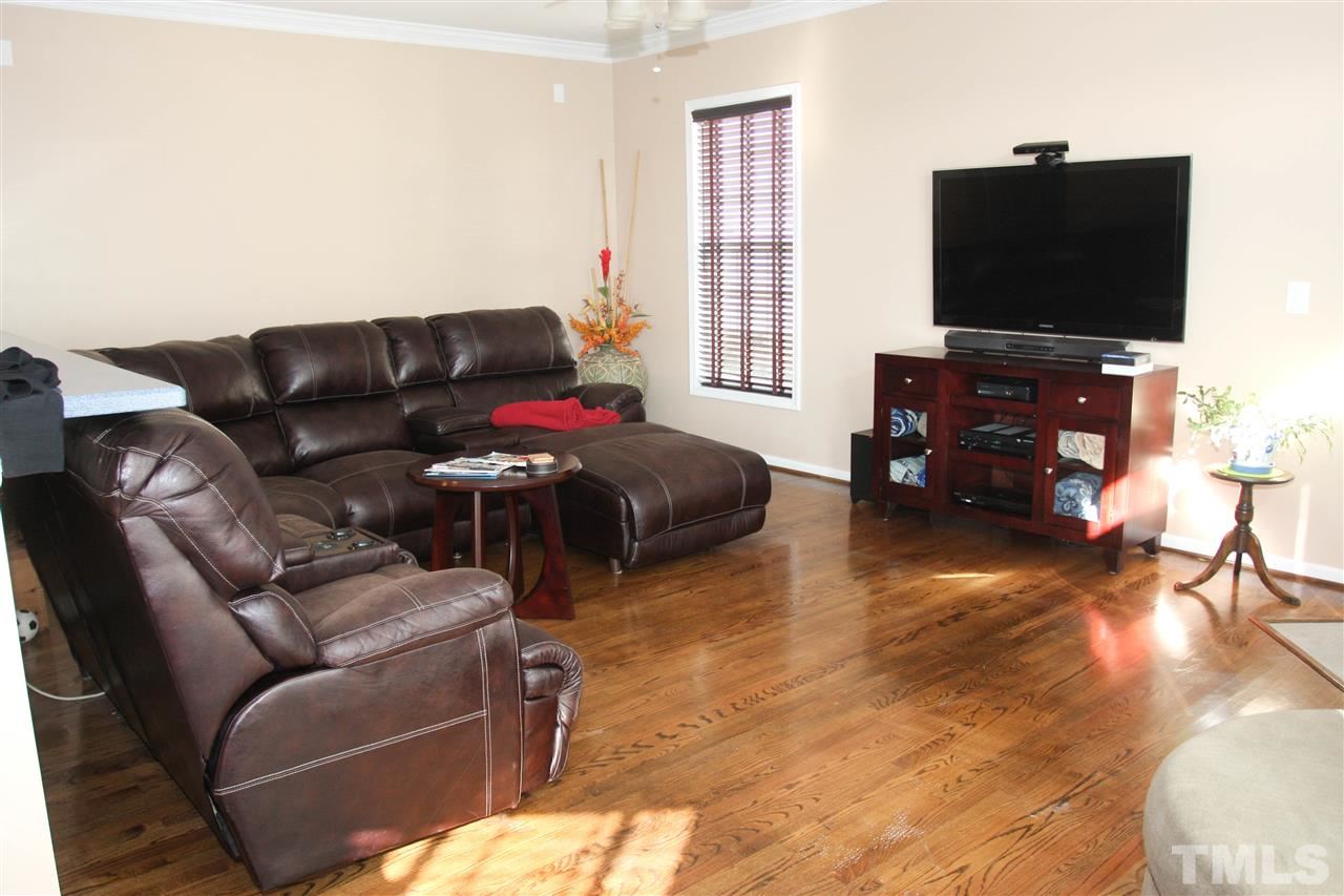 197 Mickleson Ridge Drive Raleigh, NC 27603 - Photo 13 of 25 a living room with furniture and a flat screen tv